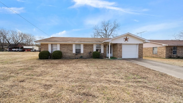 ranch-style home featuring a garage and a front lawn