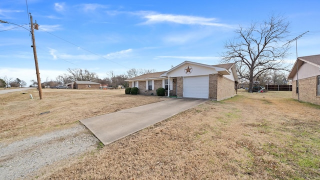 ranch-style house featuring a garage and a front lawn