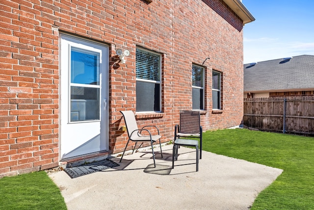 view of patio featuring fence