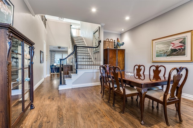 dining space featuring crown molding and hardwood / wood-style flooring