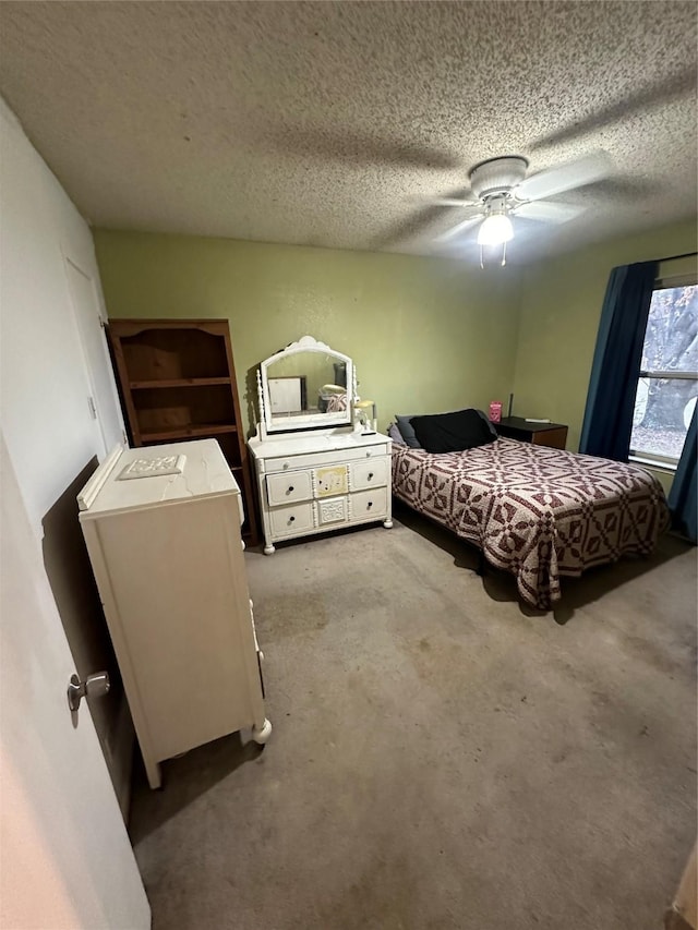 bedroom featuring a textured ceiling and ceiling fan