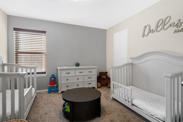 carpeted bedroom with a nursery area