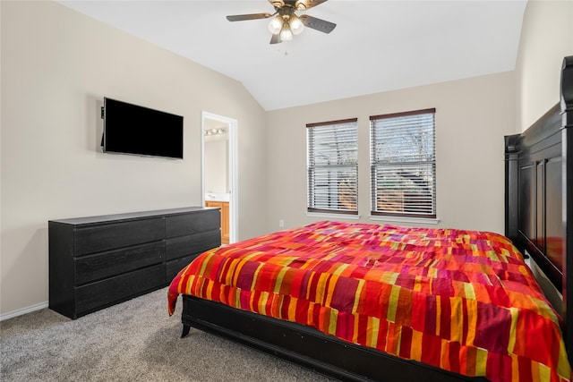 bedroom with carpet flooring, lofted ceiling, ceiling fan, and ensuite bathroom