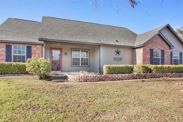 ranch-style home featuring a front yard