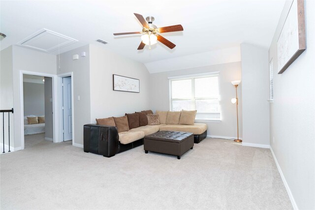 living room featuring ceiling fan, vaulted ceiling, a textured ceiling, and carpet