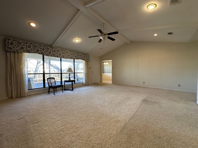 unfurnished living room with vaulted ceiling with beams, ceiling fan, and carpet