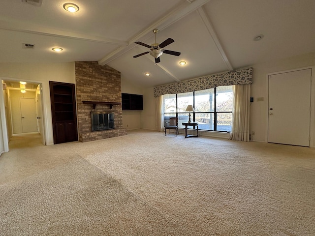 unfurnished living room featuring vaulted ceiling with beams, a fireplace, ceiling fan, and carpet