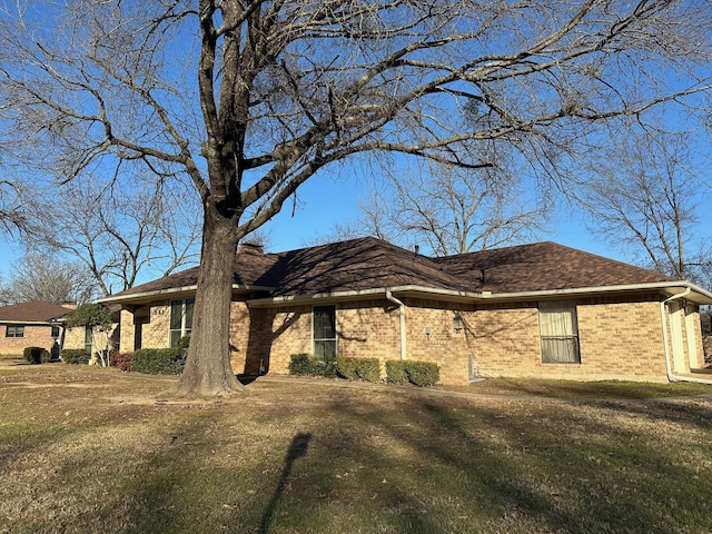 view of home's exterior with a lawn