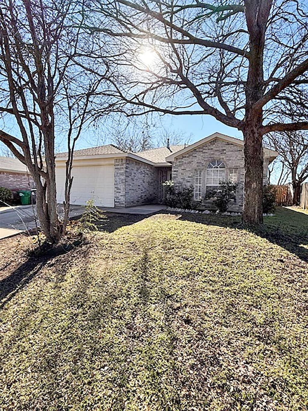 view of property exterior featuring a garage and a yard