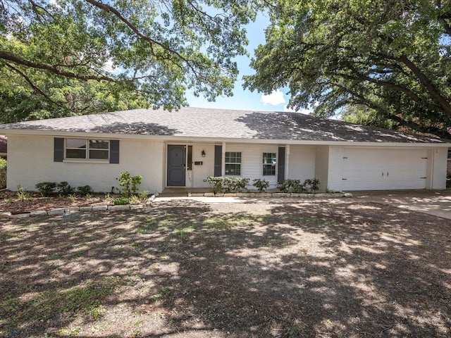 ranch-style house featuring a garage