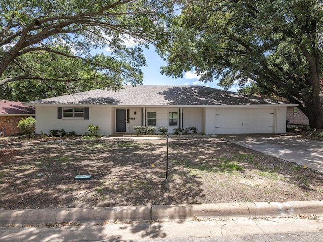 ranch-style house featuring a garage