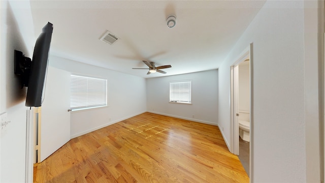 spare room with ceiling fan and light hardwood / wood-style floors