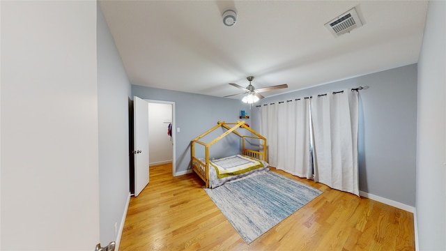 bedroom featuring hardwood / wood-style flooring and ceiling fan