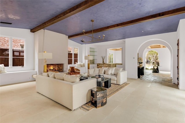 living room with lofted ceiling with beams