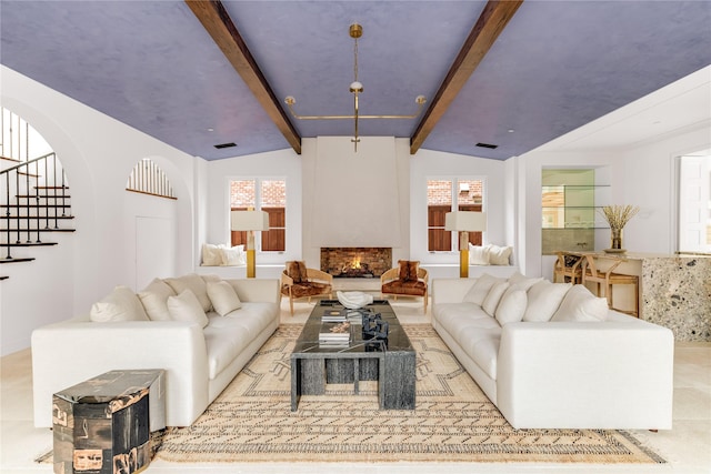 living room featuring lofted ceiling with beams