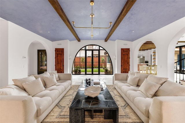 living room featuring vaulted ceiling with beams