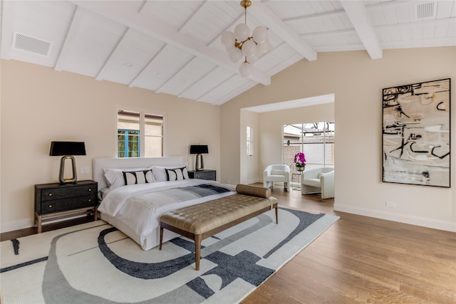 bedroom featuring vaulted ceiling with beams, hardwood / wood-style floors, and wood ceiling