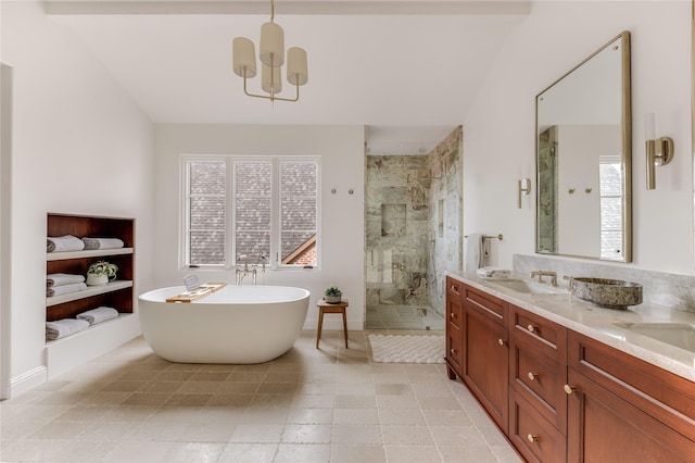 bathroom featuring a healthy amount of sunlight, vanity, separate shower and tub, and an inviting chandelier