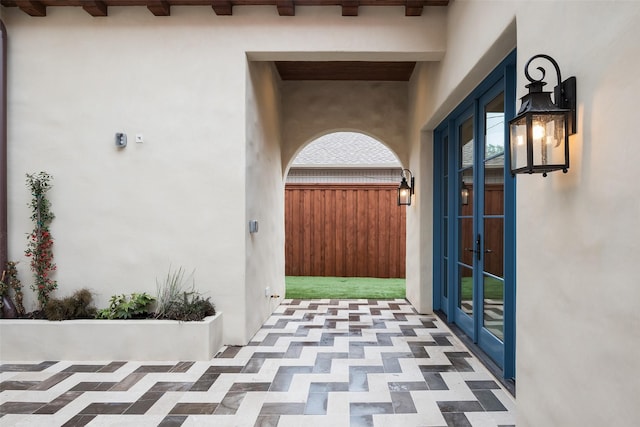 doorway to property with a patio area and french doors