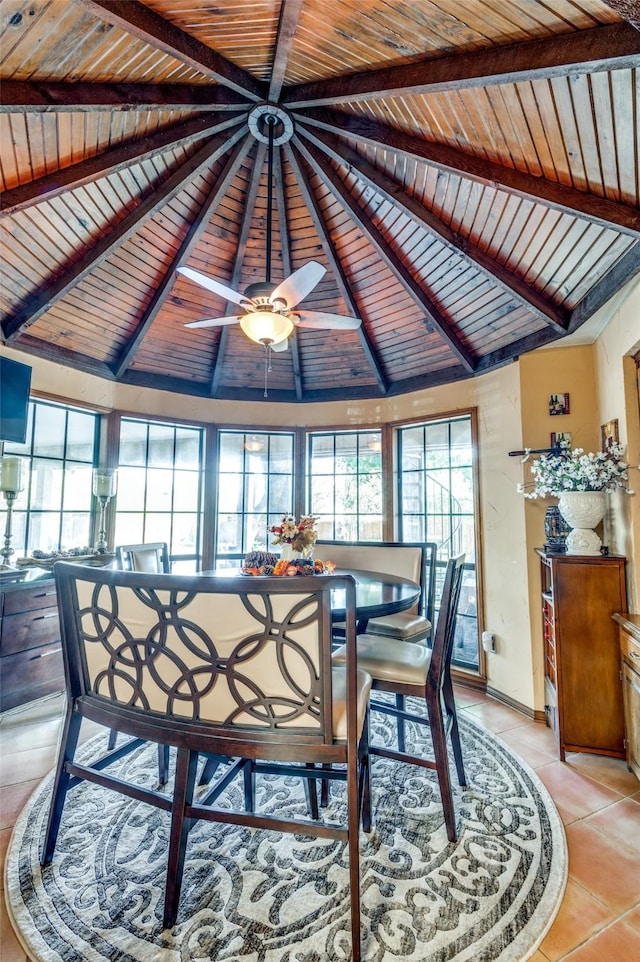 tiled dining room featuring wood ceiling and vaulted ceiling with beams