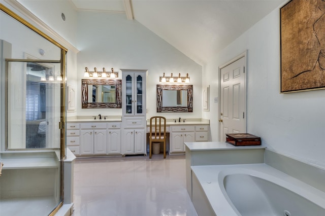 bathroom with a bathing tub, lofted ceiling, and vanity