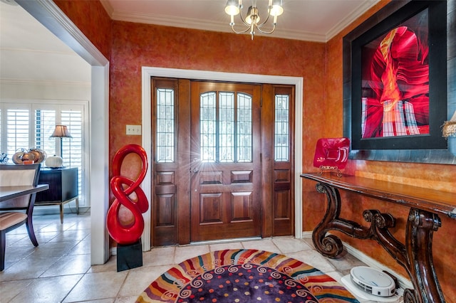 tiled foyer entrance with crown molding and a chandelier