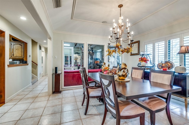 tiled dining room featuring crown molding, a tray ceiling, and a notable chandelier