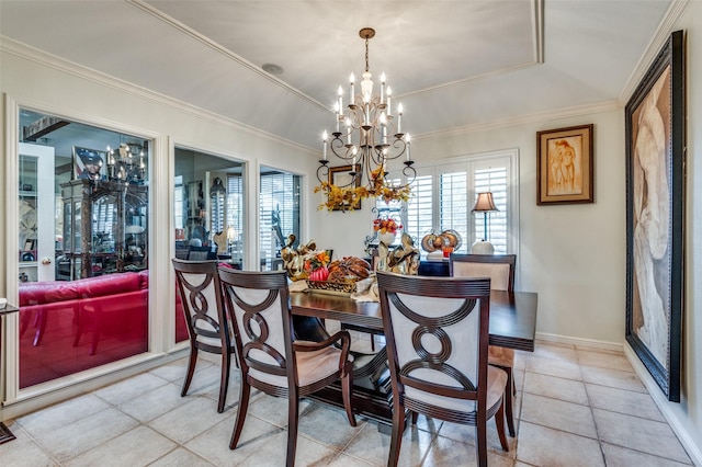 tiled dining area with an inviting chandelier, crown molding, and a tray ceiling