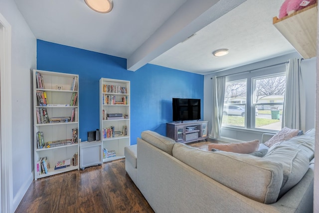 living room featuring beam ceiling and dark hardwood / wood-style floors