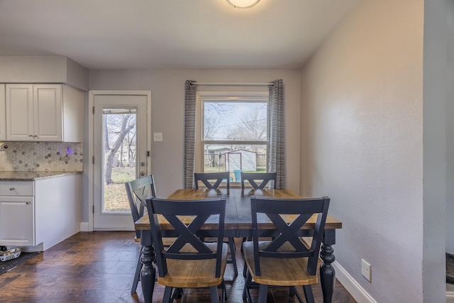 dining room with dark hardwood / wood-style floors