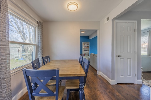 dining area featuring dark hardwood / wood-style floors and a wealth of natural light