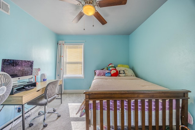 bedroom featuring light colored carpet and ceiling fan