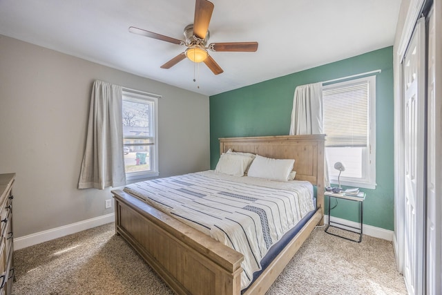 bedroom featuring ceiling fan and light carpet