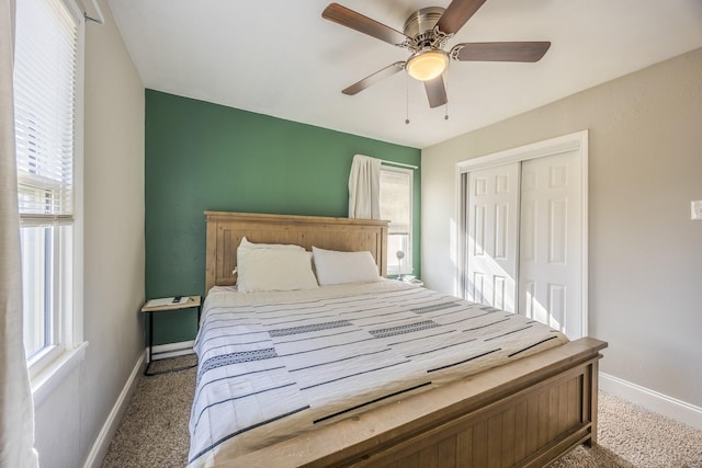 carpeted bedroom with a closet and ceiling fan