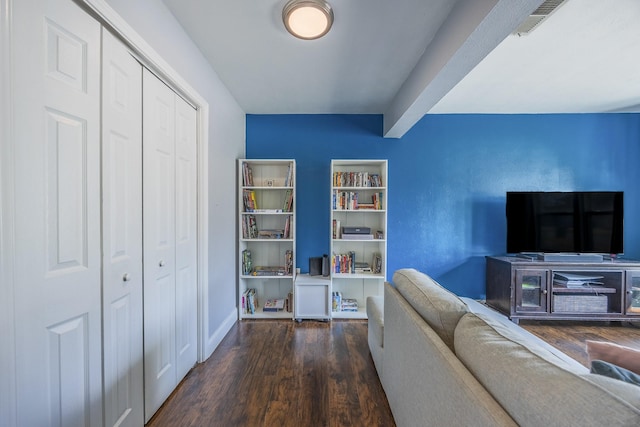 living room featuring dark wood-type flooring