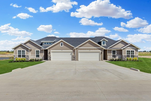 3842-3844 Clovis St, Midlothian, TX 76065 - view of front facade with board and batten siding, an attached garage, a front lawn, and driveway