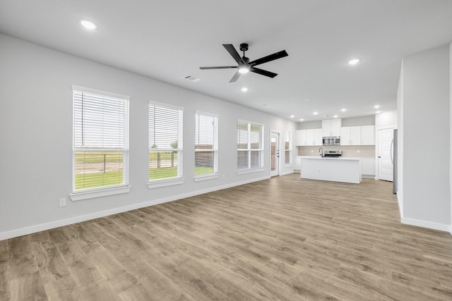 3842-3844 Clovis St, Midlothian, TX 76065 - unfurnished living room featuring recessed lighting, baseboards, light wood-style flooring, and a ceiling fan