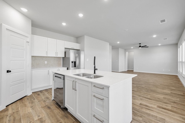 3842-3844 Clovis St, Midlothian, TX 76065 - kitchen featuring appliances with stainless steel finishes, a sink, a ceiling fan, light countertops, and recessed lighting