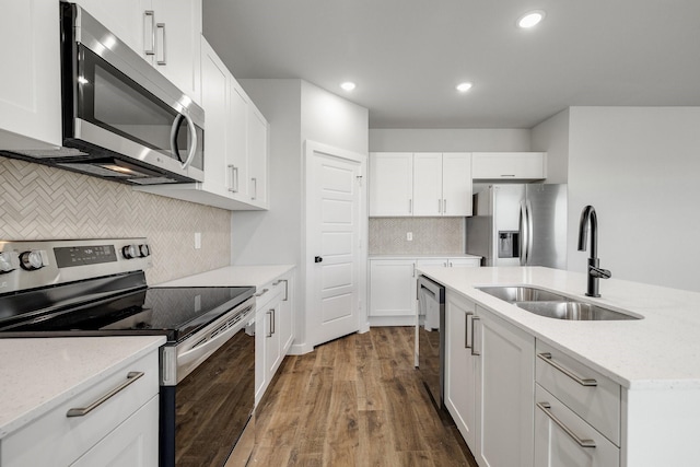 3842-3844 Clovis St, Midlothian, TX 76065 - kitchen featuring appliances with stainless steel finishes, a sink, wood finished floors, backsplash, and recessed lighting