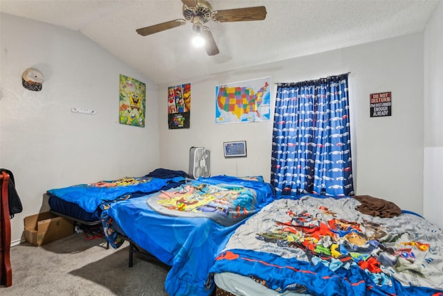 carpeted bedroom featuring a textured ceiling, vaulted ceiling, and ceiling fan