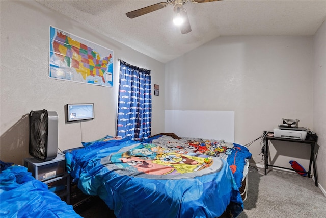 carpeted bedroom with lofted ceiling, a textured ceiling, and ceiling fan