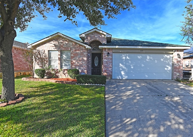 single story home featuring a garage and a front lawn