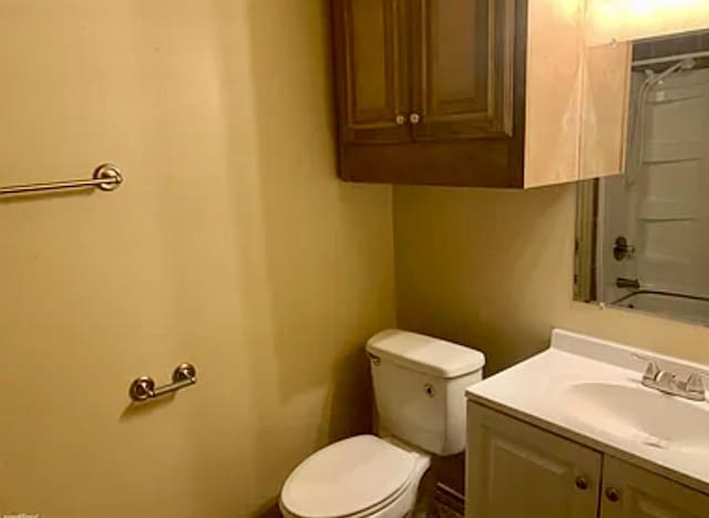 full bathroom with vanity, shower / bathing tub combination, and toilet