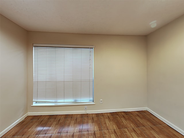 spare room featuring hardwood / wood-style flooring