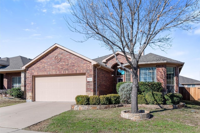 single story home featuring a garage and a front lawn