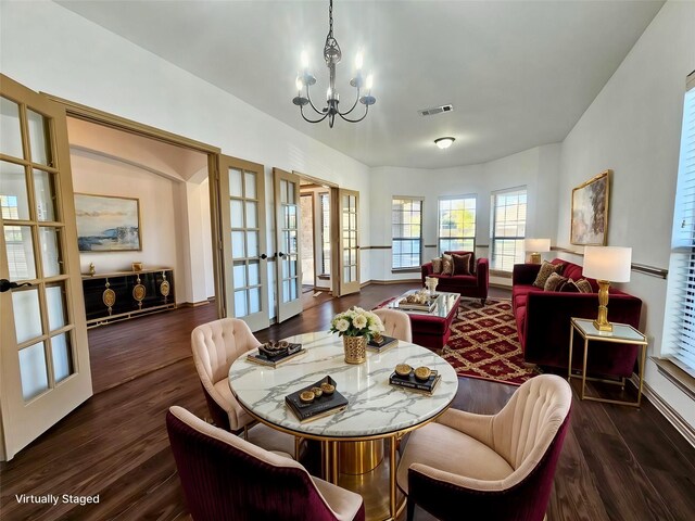 spare room with dark wood-type flooring and high vaulted ceiling