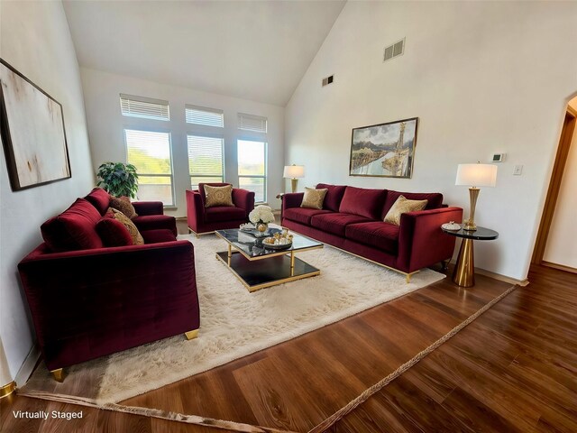 empty room with dark hardwood / wood-style flooring and a notable chandelier