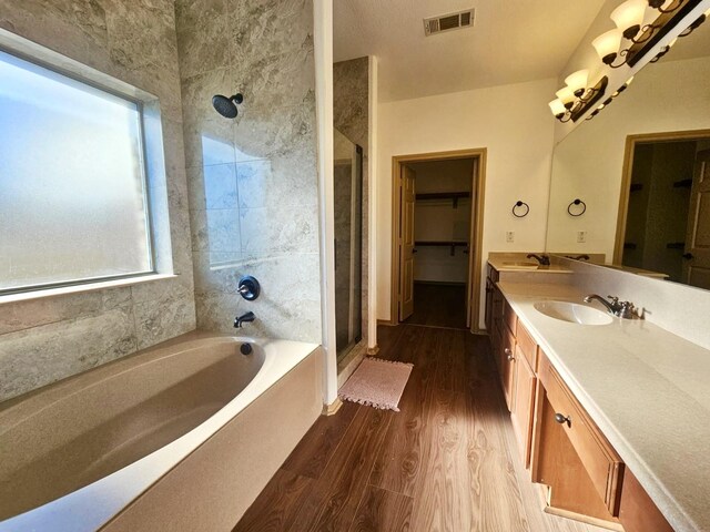 spare room featuring crown molding, dark wood-type flooring, ceiling fan, and a tray ceiling