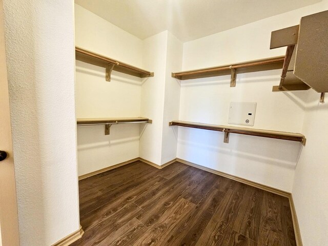 bathroom with vanity, plus walk in shower, and hardwood / wood-style floors