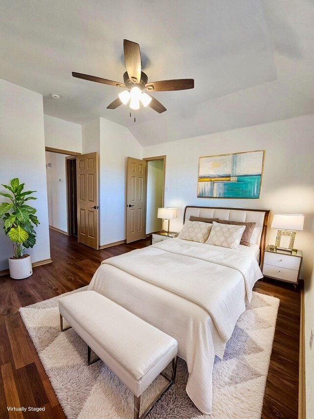 spare room featuring dark hardwood / wood-style floors and ceiling fan with notable chandelier